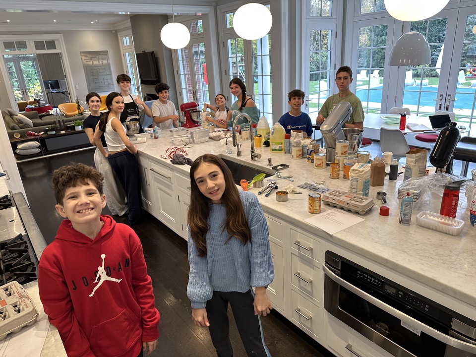 Young PeaceofCakes bakers baking together in a kitchen